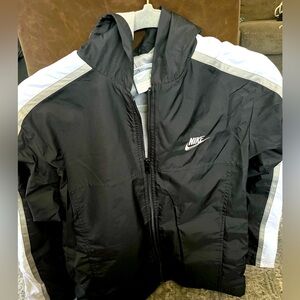 Boys Nike lightweight nylon jacket. Size is a large(14-16), with hood